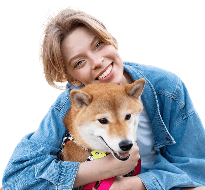 Frau Hält Hund Im Arm